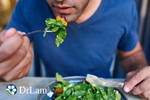 A man enjoys a fresh, nutrient-rich salad