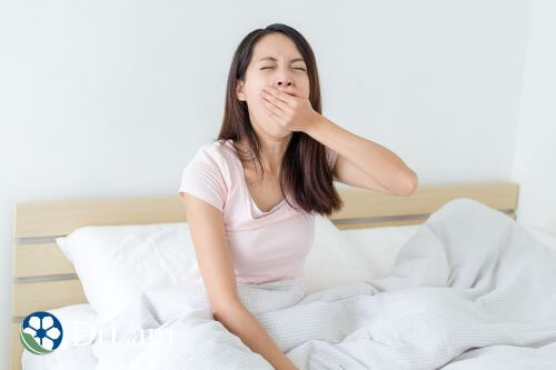 An image of a woman who is tired and sleepy