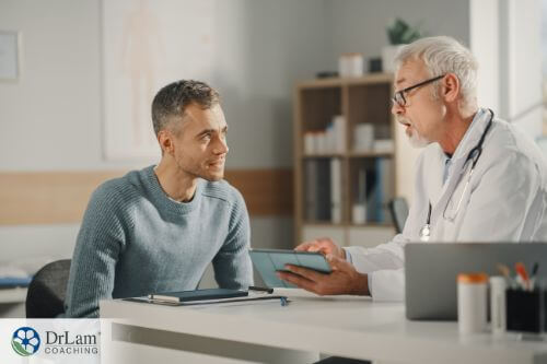 An image of a man talking with a docotor