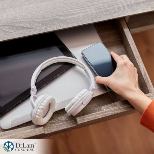 An image of someone putting away various devices