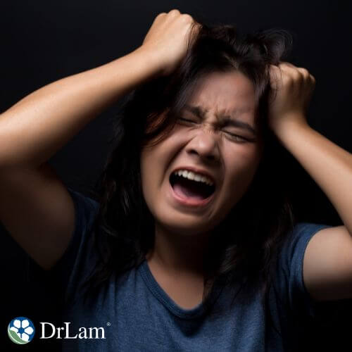 A photo of a woman suffering from Premenstrual Dysphoric Disorder