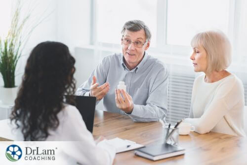An image of two persons consulting a doctor