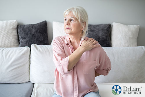 Joint pain one possible side effect An image of an older woman experiencing some joint pain