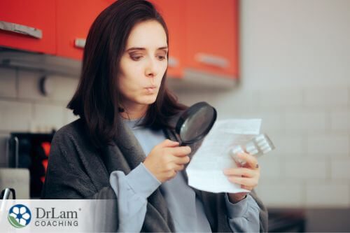 An image of a woman looking closely at the prescription