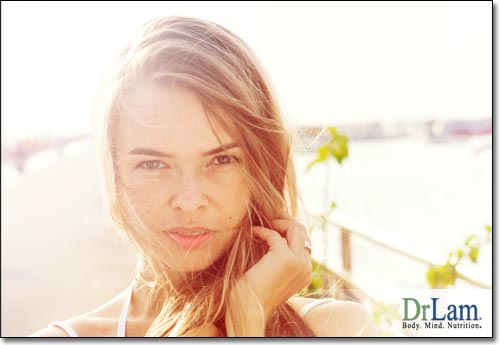 A young woman looking content outside, which is difficult if Adrenal Fatigue symptoms are not overcome